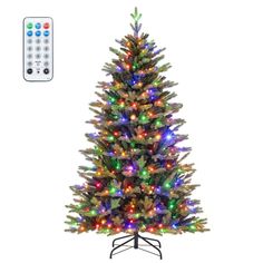 an artificial christmas tree with multicolored lights and remotes on the stand, in front of a white background