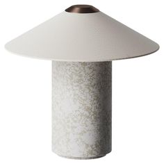 a white table lamp with a brown shade on it's top and bottom part