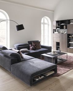 a living room with two couches and a coffee table