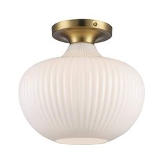 a white glass light fixture with gold trim