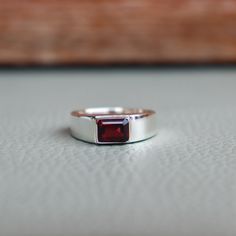 💖 Natural Red Garnet Signet Ring 925 Sterling Silver, Simple Men Cushion Red Quartz Gemstone Jewelry, Gift Ring, Engraved Ring ❥ Metal: Solid sterling silver ❥ US Ring Size: Choose Size ❥ Stone Size: 6*8 mm Octagon Emerald Cut ✈ Free Shipping (USPS) ✈ Free Shipping United Kingdom 🎁 Free Gift Box ↻ 3 Days Return ⌛ 3-Day Handling Time 💖 General Care Instructions Remove jewellery when showering or bathing. This is particularly important when on the beach, in the sea and in chlorinated water Avoid wearing jewellery when doing physical work such as housekeeping, gardening or exercise Never expose jewellery to household cleaning products, especially bleach and highly reactive solutions Avoid spraying perfume, or hairspray on the gemstones or pearls as it jeopardizes the integrity of the mater Classic Red Garnet Signet Ring, Red Garnet Signet Ring For Anniversary, Classic Red Sterling Silver Birthstone Ring, Classic Red Birthstone Ring In Sterling Silver, Red Quartz, Garnet Gem, Engraved Ring, Silver Signet Ring, Red Band