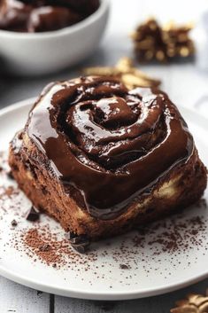 a piece of chocolate cake on a white plate