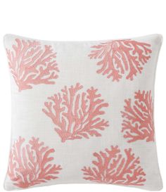 coral print pillow on white background