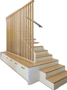 a stair case with drawers underneath it and a handrail on the top, next to a set of stairs