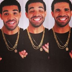 three men wearing gold chains and smiling at the camera