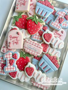 some decorated cookies are sitting on a tray