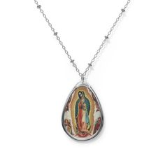 Add a custom touch to what you're wearing with this necklace showing the beautiful painting of Our Lady of Guadalupe painted by Miguel Cabrera in 1750 The pendant and its chain are made with robust brass material for dazzling looks that are long-lasting. The print panel is made with aluminum while the pendant itself comes in a unique shape of an ellipse. .: Brass pendant and necklace chain .: Ellipse-shaped pendant .: White aluminum print surface .: Lobster clasp closure Silver Our Lady Of Guadalupe Necklace, Spiritual Our Lady Of Guadalupe Jewelry Gift, Oval Our Lady Of Guadalupe Jewelry Gift, Oval Our Lady Of Guadalupe Necklace Gift, Oval Our Lady Of Guadalupe Necklace For Gift, Spiritual Oval Our Lady Of Guadalupe Necklace, Spiritual Oval Necklace Featuring Our Lady Of Guadalupe, Catholic Confirmation, Virgin Of Guadalupe