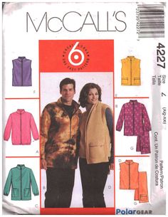 a man and woman standing next to each other in front of an advertisement for jackets