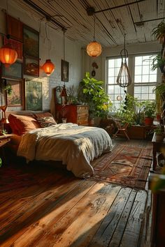 a bedroom with wooden floors and lots of plants in the window sill, along with hanging lights