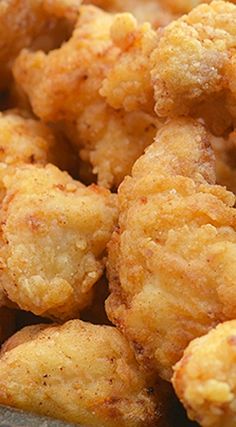 some fried food is in a bowl on the table and ready to be eaten for consumption