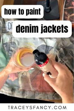 someone is holding a bottle and pointing at it with the words how to paint denim jackets