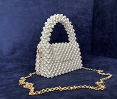 Brand: Etsy
Seller: SERENORA Handheld Clutch With Pearl Handle, Handmade Pearl White Evening Bag For Events, White Clutch With Pearl Handle, White Evening Bag With Pearl Chain, Handmade Pearl Handheld Evening Bag, Handheld Pearl Evening Bag Handmade, Handmade Pearl Evening Bag For Events, Luxury Pearl Bag As Gift, Elegant Bags With Pearl Chain For Gift