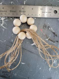 eggs are laid out on a piece of wood next to a tape measure ruler, which has been used as an ornament