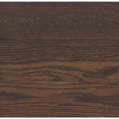 a close up view of the wood grains on this wooden flooring material, which looks like it has been stained dark brown