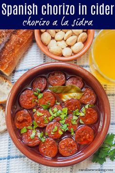 spanish chorizo in cider with bread and vegetables