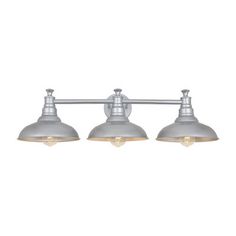 three light bathroom fixture with white glass shades and metal finish, on an off - white background