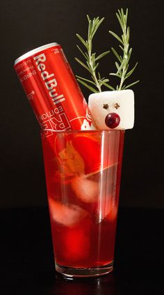 a drink in a glass with a bear head sticking out of it's side