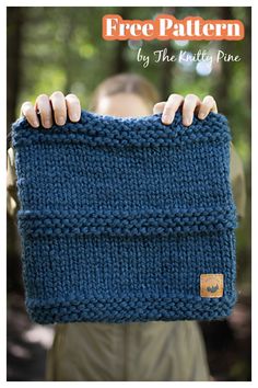 a person holding up a blue knitted bag with the words free pattern on it