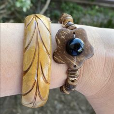 Two Wood Bracelets 1. Wood Beaded Bracelet Adjustable Handmade With A Flower In The Center 2. A Bangle Hand Carved Bought These Two On A Trip To The Caribbean They Are Both Unique Due To Them Being Handmade And Have The Natural Look Of Wood You Can Wear Them Together Or Separated In An Excellent Pre-Owned Condition They Come From A Smoke Free Home Brown Adjustable Flower Bracelet, Wooden Bangles, Handmade Wooden Jewelry, Wooden Bangle Bracelet, Wooden Bangle, Wood Bead Bracelet, Wood Bracelet, Wooden Jewelry, Natural Look