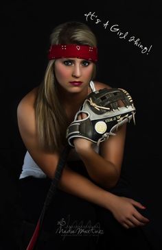 a woman wearing a catchers mitt and holding a baseball glove with the words it's a girl thing