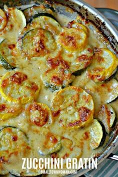 a casserole with zucchini and cheese in a pan on a table