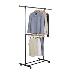 a clothes rack with three shirts hanging on it's sides and two pants in the middle