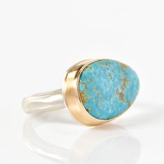 Set in a 14K yellow gold bezel with sterling silver platform Kingman turquoise Middle groovy band Dimensions 0.55 x 0.76" Size 7 Not your ring size? Please add a ring sizing to your cart if you need a different size. Contains natural stone. The appearance of each piece may vary. Silver Platforms, Bold Statement Necklaces, Kingman Turquoise, Delicate Rings, Engagement Ring Wedding Band, Mens Wedding Rings, Artistic Jewelry, Ring Collections, Mens Wedding Bands