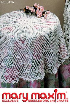 there is a table and chairs covered with lacy doily on this advertisment