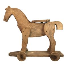 a wooden toy horse is shown on a white background