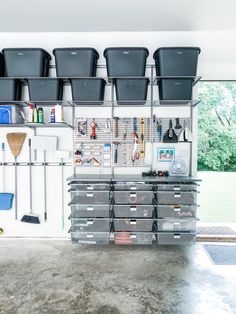 a garage with several bins on the wall