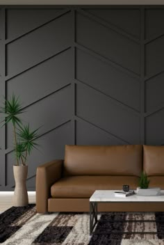 a brown leather couch sitting in front of a white table on top of a rug