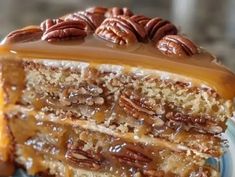 a piece of cake with pecans and caramel on top