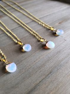 Beautiful white and iridescent opal stone necklace with petite resin pendants on elegant gold plated chain. Brilliantly colorful opaque opal pendants, elegant rainbow colors, and paired with 18 karat gold plated stainless steel necklace chain. Colorful hues mingle together to create this naturally stunning stone jewelry piece. ♡ Made with 18 karat gold plated stainless steel necklace chain at 18 inches of length. Boldly colorful resin jewelry ♥ Be sure to check out the NECKLACE section at Earrin Opal Resin, Gold Necklace Chain, Real Gold Necklace, Resin Pendants, Necklace Resin, Necklace Opal, Clover Necklace, Resin Necklace, Necklace Crystal