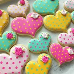 decorated heart shaped cookies on a table