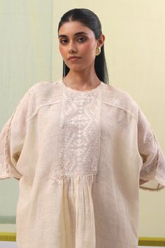 Beige kimono sleeves high neck tunic with geometric silk thread embroidery on the yoke and bloom patri embroidery. Paired with a matching geometric embroidered pant. - Aza Fashions Traditional Top With Kimono Sleeves, Beige Kimono, Tunic With Pants, Silk Thread Embroidery, Linen Embroidery, Pant For Women, Embroidered Pants, Tunic Pattern, Kimono Sleeves