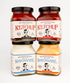 three jars of mayonnaise and ketchup sitting next to each other