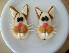 two cats made out of cookies on a white plate