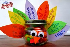 a jar filled with gummy bears and a turkey face on top of the jar