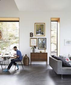 a man sitting at a table in a living room