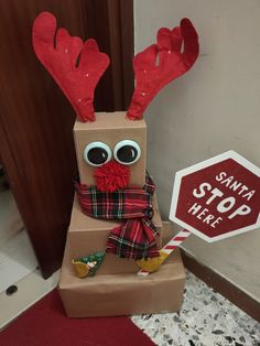 a cardboard box that has been made to look like a reindeer