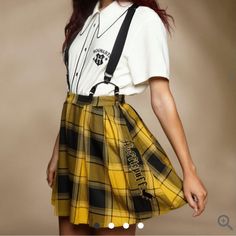 Brand New Never Worn Harry Potter Hufflepuff Pleated Suspender Skirt Size Large Nwt. Add Some Magical Flair To Your Wardrobe With This Harry Potter Suspender Skirt. Featuring A Plaid Print In The Hufflepuff House Colors Plus “Hufflepuff “ Embroidered Along The Side With A Badger . Comes With Removable Adjustable Suspender Straps, Perfect For Adding A Little Extra Prep To Your Look Complete With A Partial Elasticated Waistband And A Side Zipper Closure. 80% Polyester 18% Rayon 2% Spandex Wash Col Hufflepuff Outfit, Harry Potter Hufflepuff, Suspender Skirt, Plus Size Fits, Sweaters And Jeans, Plaid Print, Warner Bros, Suspenders, Badger