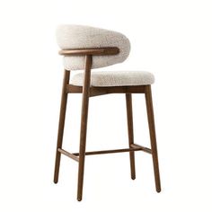 an upholstered bar stool with a wooden frame and backrest in white fabric