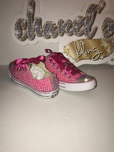 Custom Bling Converse All Star Chuck Taylor Sneakers. All designs handmade and embellished with a variety of high quality crystals. Great for weddings, proms, homecomings, birthdays, special events or just your everyday girly girl. Turn around time is currently 2 - 3  weeks **IF YOU NEED THIS ITEM BEFORE THE PROJECTED SHIPPING TIME YOU MUST CONTACT US BEFORE ORDERING (additional charges may apply) **Shoe Details:Classic PINK low top Converse All Star Chuck Taylor Sneaker (cloth material style)Sh Pink Embellished Sneakers For Party, Pink Rhinestone Party Sneakers, Pink Low Top, Bling Converse, Ribbon Shoes, Low Top Converse, Custom Bling, Bling Shoes, Rhinestone Shoes