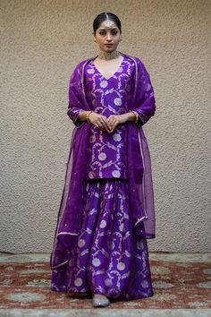 Purple three fourth sleeves V neck Banarasi kora silk kurta with woven Bahar details. Paired with a matching gathered flare sharara and a mukaish butti embellished dupatta. - Aza Fashions Umbrella Sharara Suit, Purple Sharara Designs, Banarasi Kurta Set, Banarasi Garara Designs, Banarasi Suit Designs Latest, Garara Suits Designs, Sharara Suit Designs Latest, Banarasi Suit Designs, Garara Designs