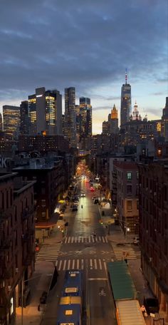 the city skyline is lit up at night