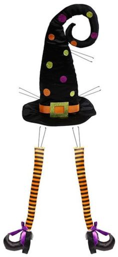 a cat with a witches hat and striped socks on it's legs, standing in front of a white background