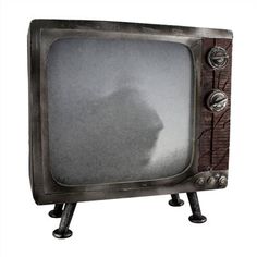 an old fashioned television with the shadow of a cat on it's face and legs