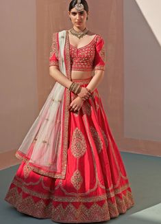 Features a regal red raw silk lehenga set embroidered with moti shaped motifs in traditional zardozi technique using silken threads, dabka, cutdana and sequins. Completed with two embroidered dupattas in red and light mint. Composition : Lehenga and Blouse - Raw Silk, Dupatta- Net Care: Dry Clean Only and Vacuum Storage This product can be customised for sleeves, length of blouse and neckline Delivery : 6-8 weeks as the product is hand crafted. Check Size Guide or choose MySize for free customis Embroidered Raw Silk Lehenga For Traditional Ceremonies, Traditional Red Designer Lehenga, Transitional Red Embroidered Lehenga, Red Dola Silk Choli For Traditional Ceremonies, Red Dola Silk Lehenga For Traditional Ceremonies, Red Lehenga With Traditional Drape For Transitional Season, Traditional Red Lehenga For Reception, Red Bollywood Lehenga For Transitional Season, Bollywood Style Red Lehenga For Transitional Season