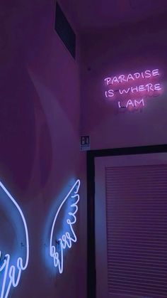 two neon signs that are on the wall