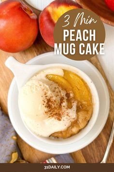 three peach mug cake in a white bowl on a wooden cutting board